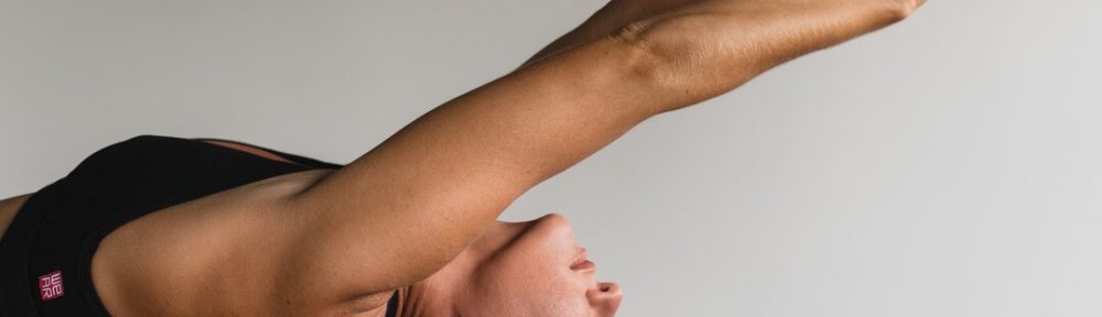 A woman is doing yoga in the air